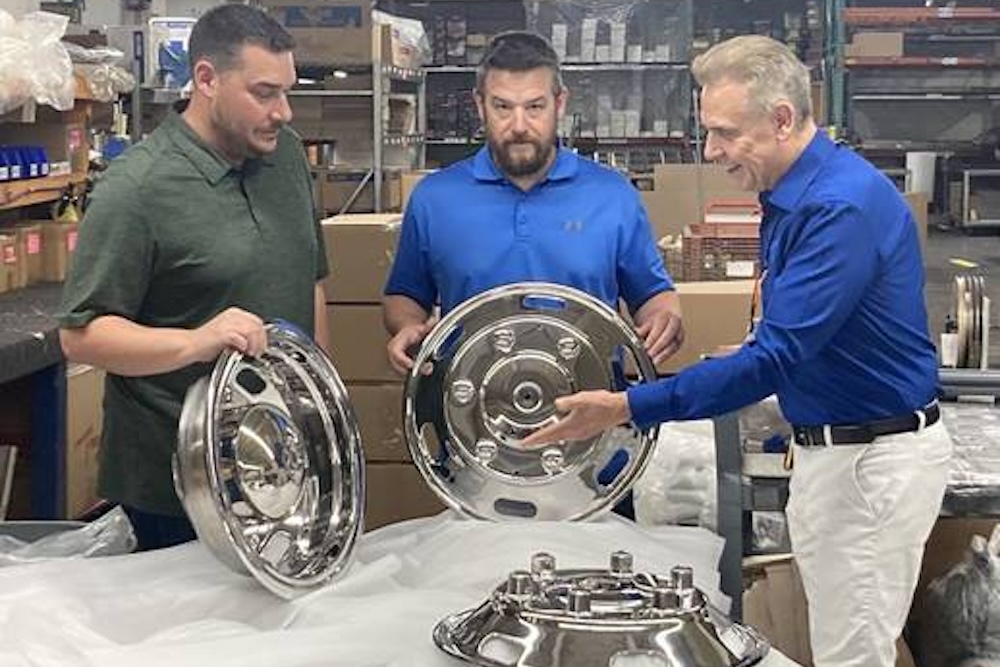 RealWheels, which moved its plant from Waukegan to Zion and renovated a vacant building in the process, has 60 employees who make wheel covers and other automotive parts for companies around the world. Talking about some of RealWheels’ wheel covers are, from left, Cory, Greg and Jan Polka. (Steve Sadin/Lake County News-Sun)